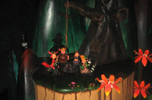 Peter Pan's Lost Boys cast fake shadows at Hangman's Tree in Peter Pan's Flight