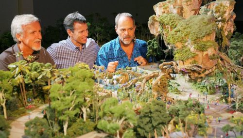 James Cameron, Tom Staggs, and Joe Rohde study the Pandora model