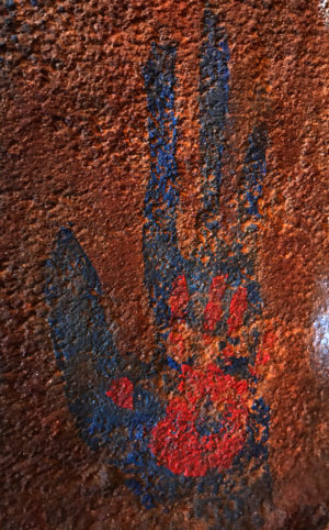 Human and Na'vi handprints in the Avatar Flight of Passage cave