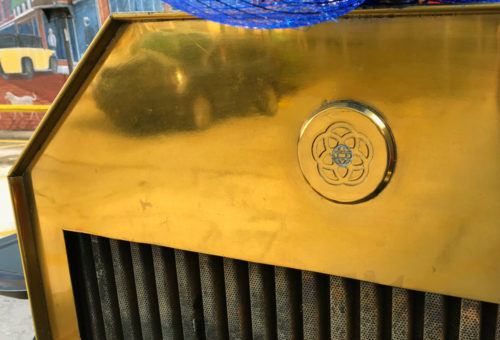 The original Epcot Center logo on the grill of the double-decker bus