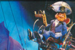 Dreamfinder aboard the Dream Machine in Journey Into Imagination