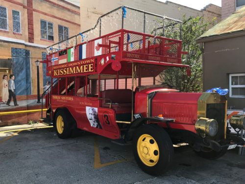 The World Showcase Characters on Holiday double-decker bus in downtown Kissimmee