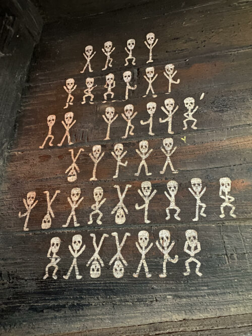 The dancing skeleton riddle on Pirate's Lair on Tom Sawyer Island is an homage to Sherlock Holmes Dancing Men puzzle.