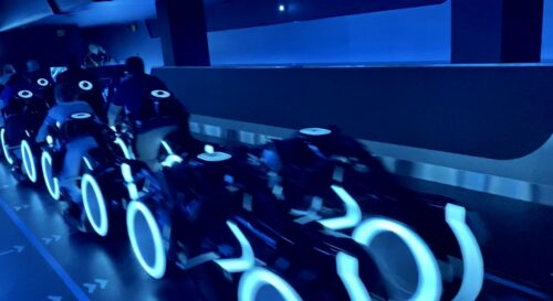 Lightcycles leave the station at TRON Lightcycle Run