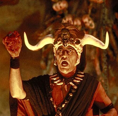 Mola Ram holds a beating heart in Indiana Jones and the Temple of Doom