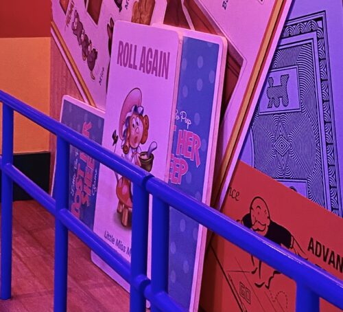 Giant Little Miss Muffet "Roll Again" playing card for the Bo Peep Toy Story Board Game inside the queue for Toy Story Mania at Disney's Hollywood Studios