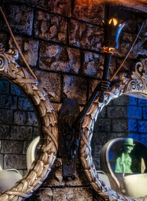 Haunted Mansion arm holding torch